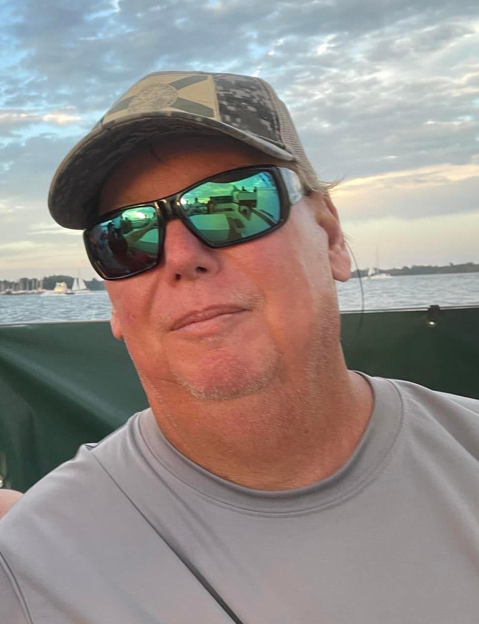 Capt. Jim Lemke holding a trophy redfish