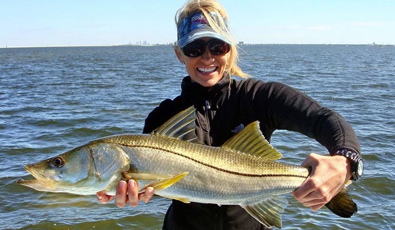 Tampa Bay fishing client holding a huge Snook.