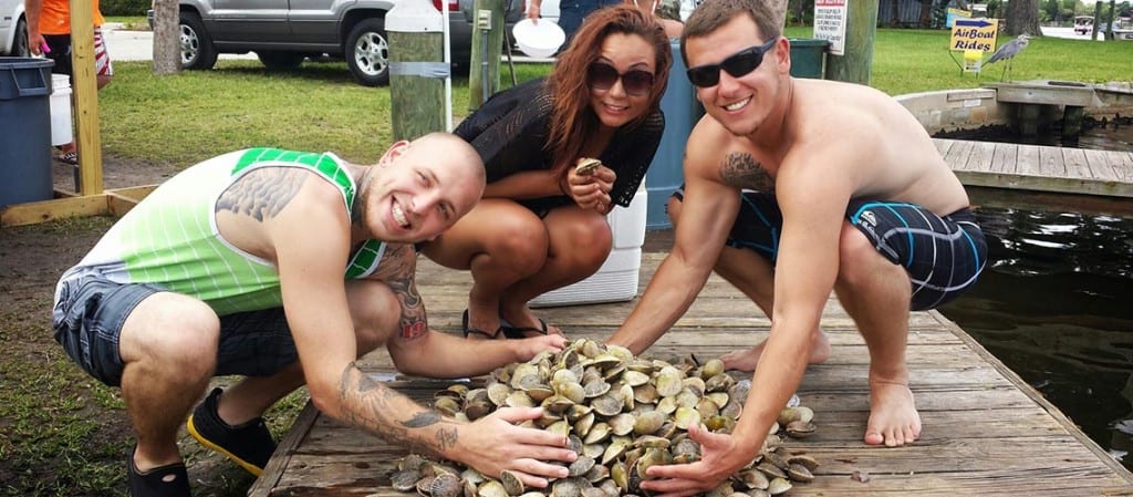 Homosassa Scalloping Charter clients happy with a pile of scallops.